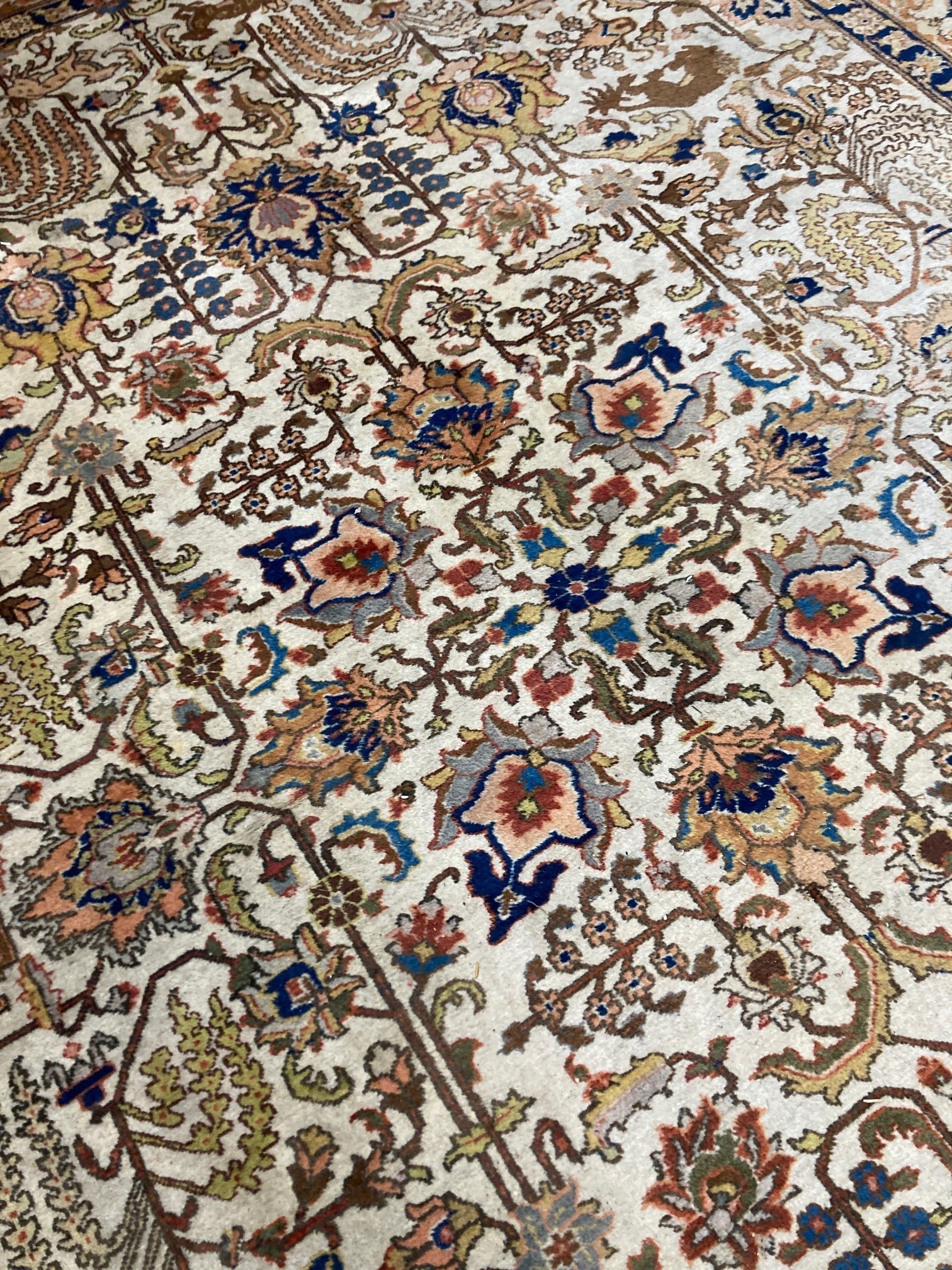 A modern Persian ivory ground rug, 340 x 260cm